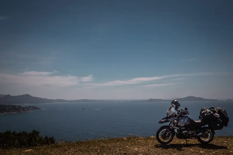 BMW GS on cliff overlooking the sea — cinematic