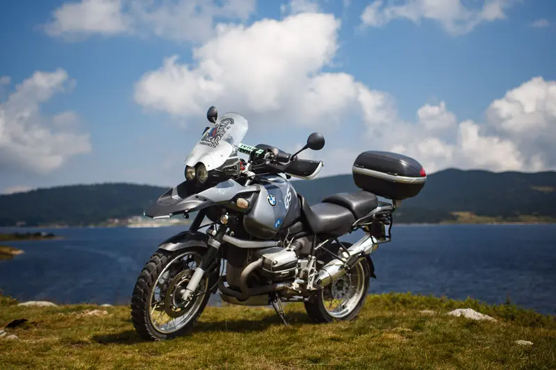 BMW GS lakeside under blue sky